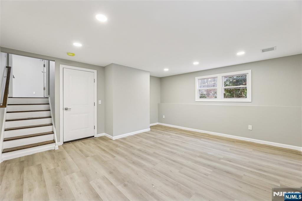448 Morsetown Road West Milford, NJ 07480 - Photo 21 of 27 a view of an empty room with wooden floor and closet