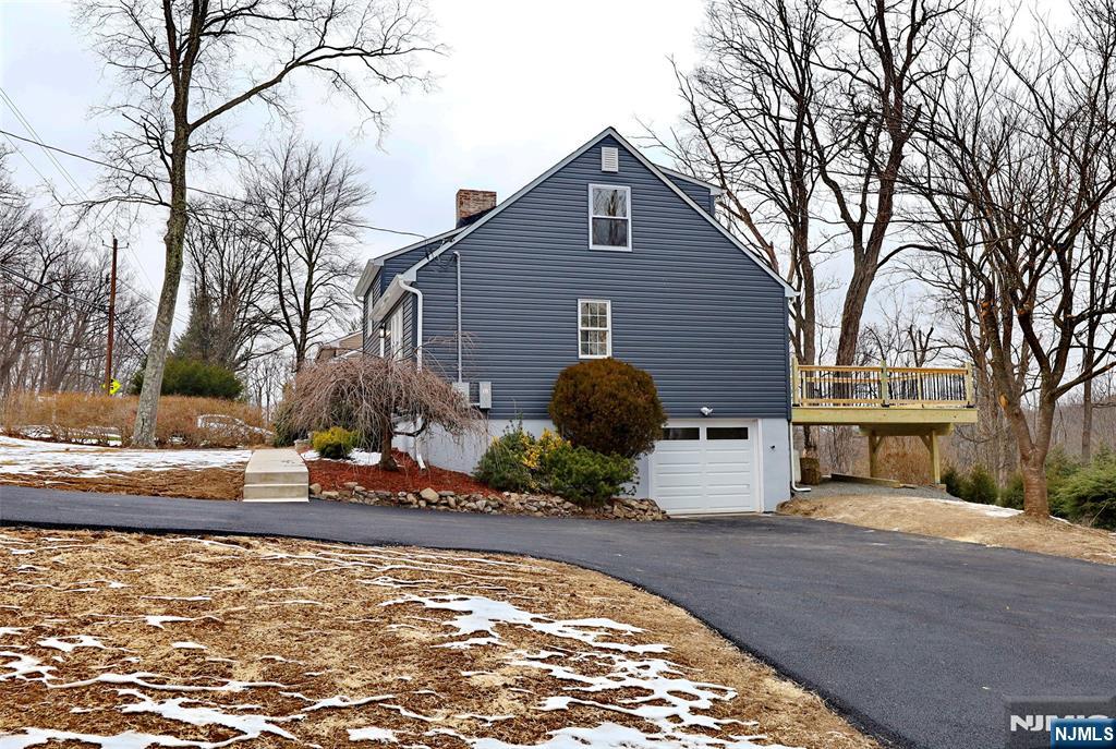 448 Morsetown Road West Milford, NJ 07480 - Photo 27 of 27 a view of a house with backyard and trees