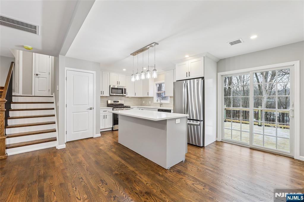 448 Morsetown Road West Milford, NJ 07480 - Photo 5 of 27 a kitchen with a refrigerator and a stove top oven