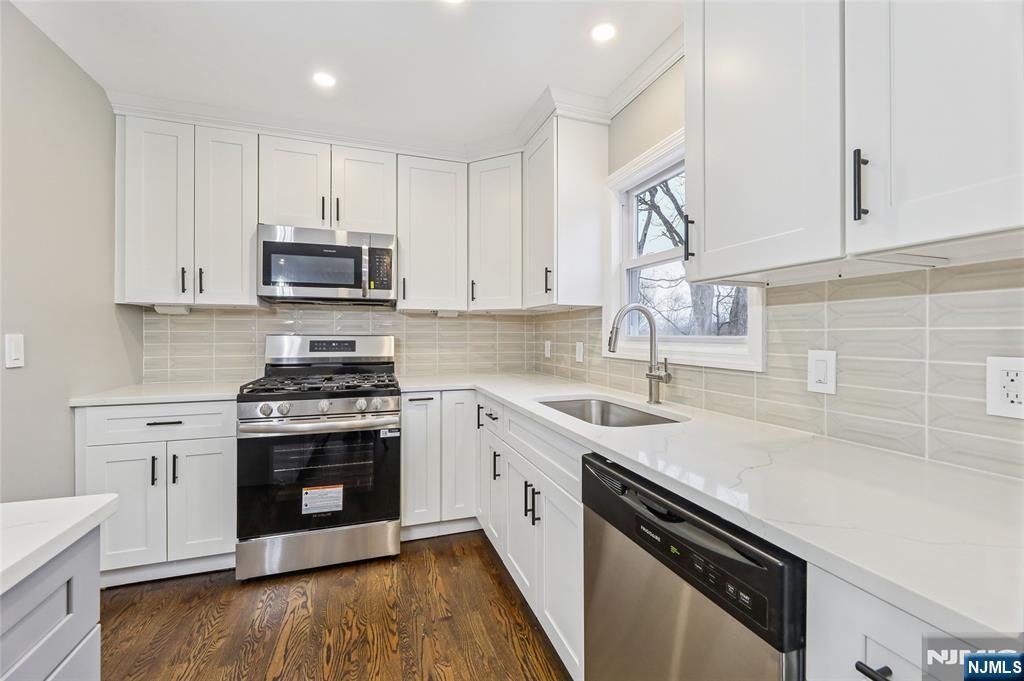 448 Morsetown Road West Milford, NJ 07480 - Photo 6 of 27 a kitchen with cabinets stainless steel appliances a sink a stove and cabinets