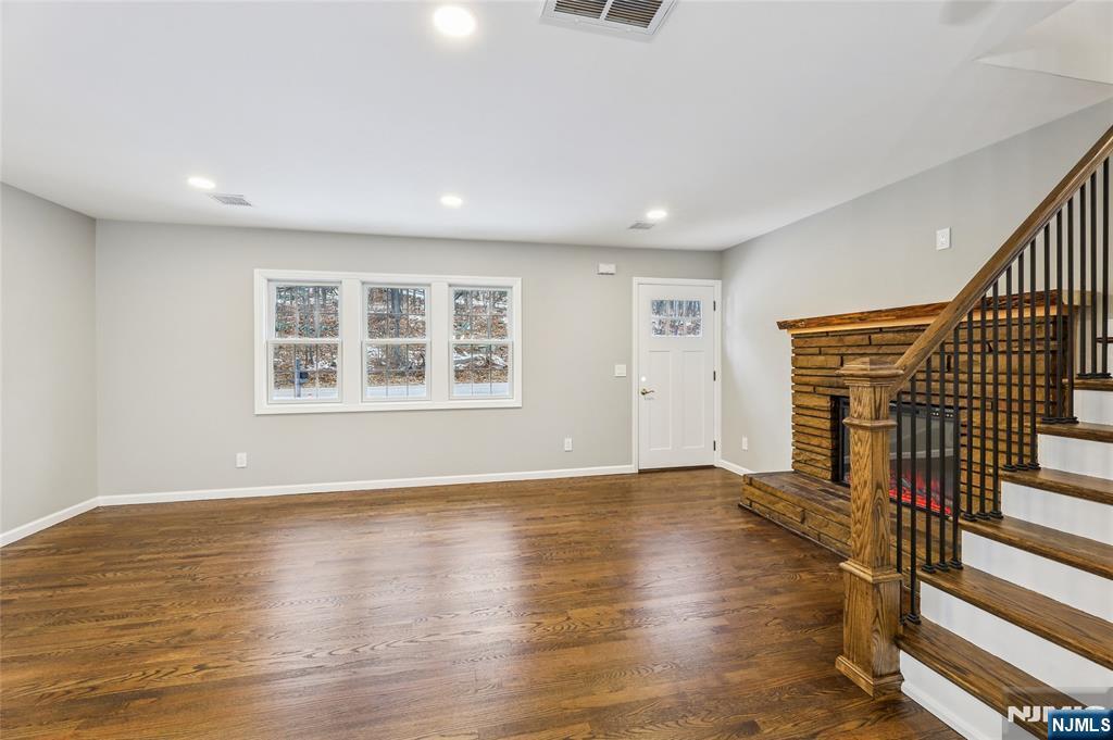 448 Morsetown Road West Milford, NJ 07480 - Photo 10 of 27 an empty room with wooden floor and windows