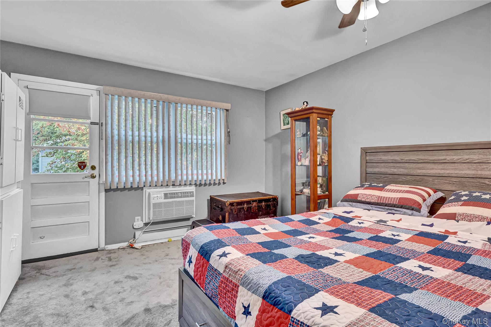 20 Toehee Place, Unit 2B Islip, NY 11751 - Photo 13 of 25 a bedroom with a bed and a window