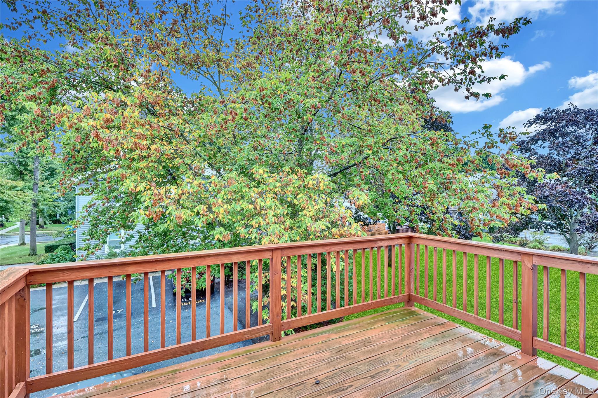 20 Toehee Place, Unit 2B Islip, NY 11751 - Photo 14 of 25 a view of balcony with wooden floor
