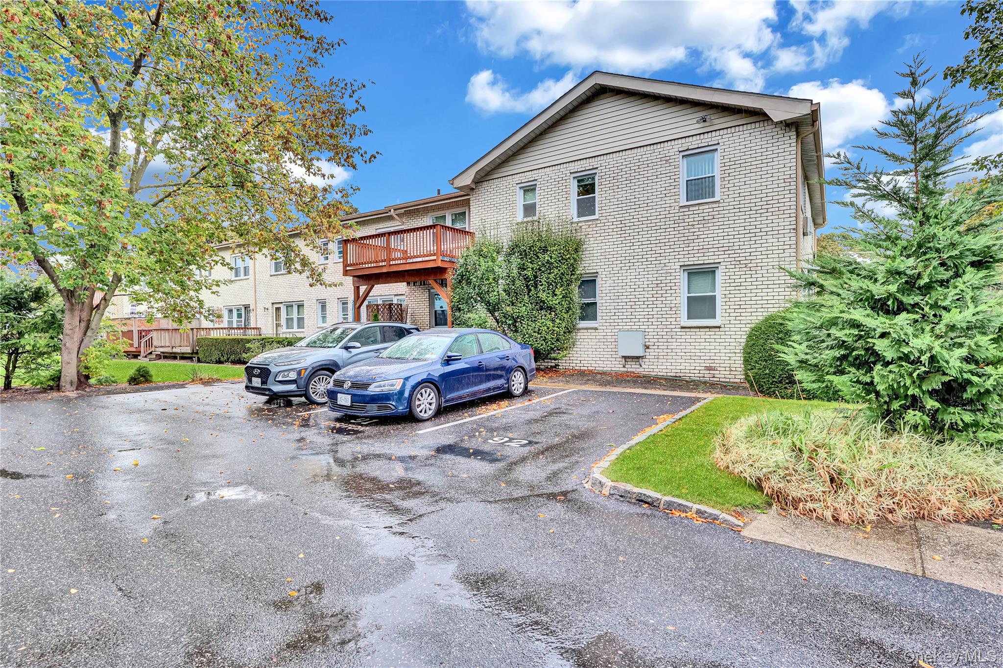 20 Toehee Place, Unit 2B Islip, NY 11751 - Photo 15 of 25 a view of a house with a patio