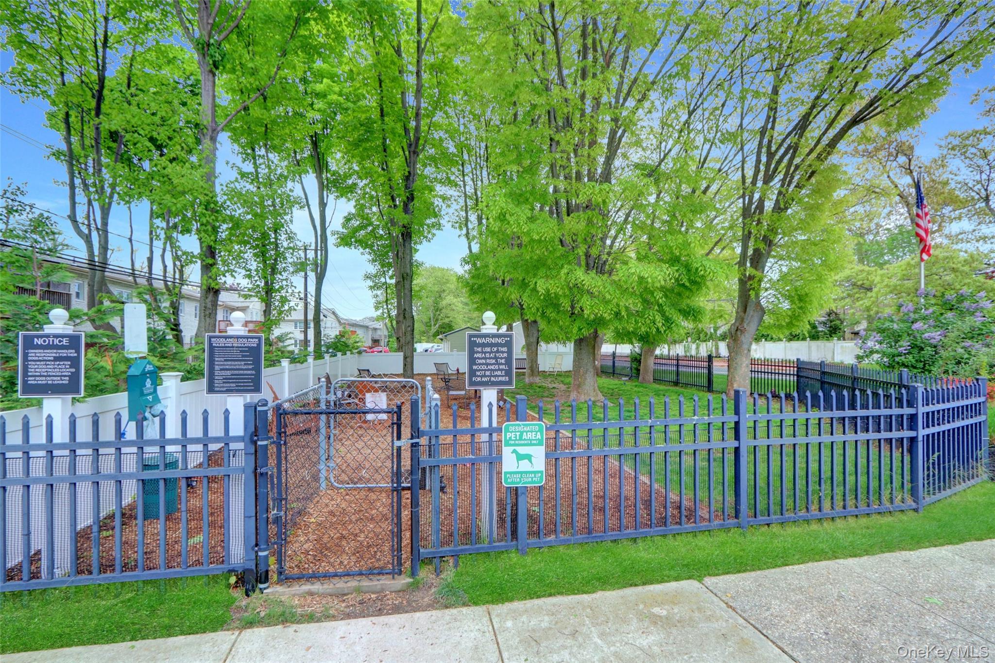 20 Toehee Place, Unit 2B Islip, NY 11751 - Photo 20 of 25 a view of a yard and a park