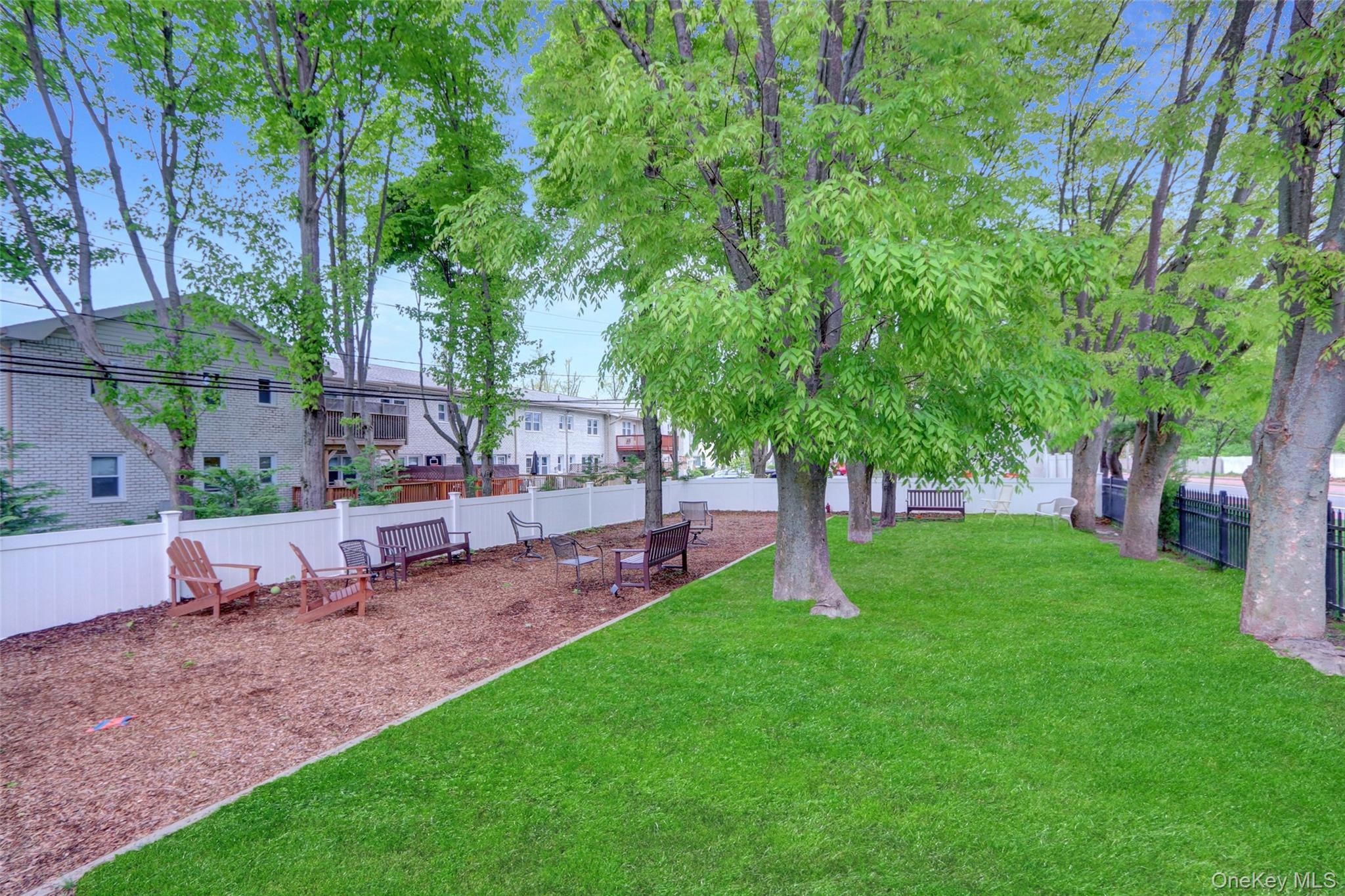 20 Toehee Place, Unit 2B Islip, NY 11751 - Photo 21 of 25 a view of a backyard with a garden