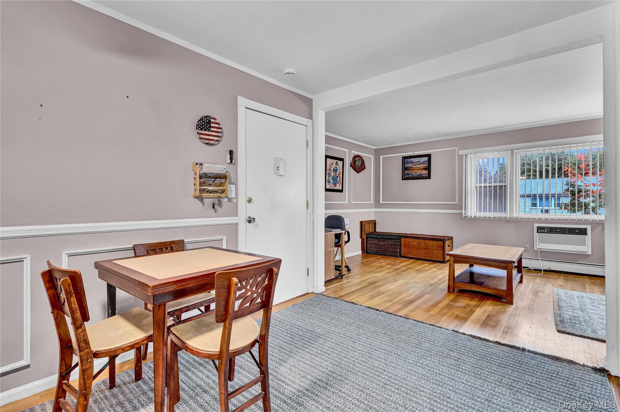 20 Toehee Place, Unit 2B Islip, NY 11751 - Photo 3 of 25 a living room with furniture a rug and a table