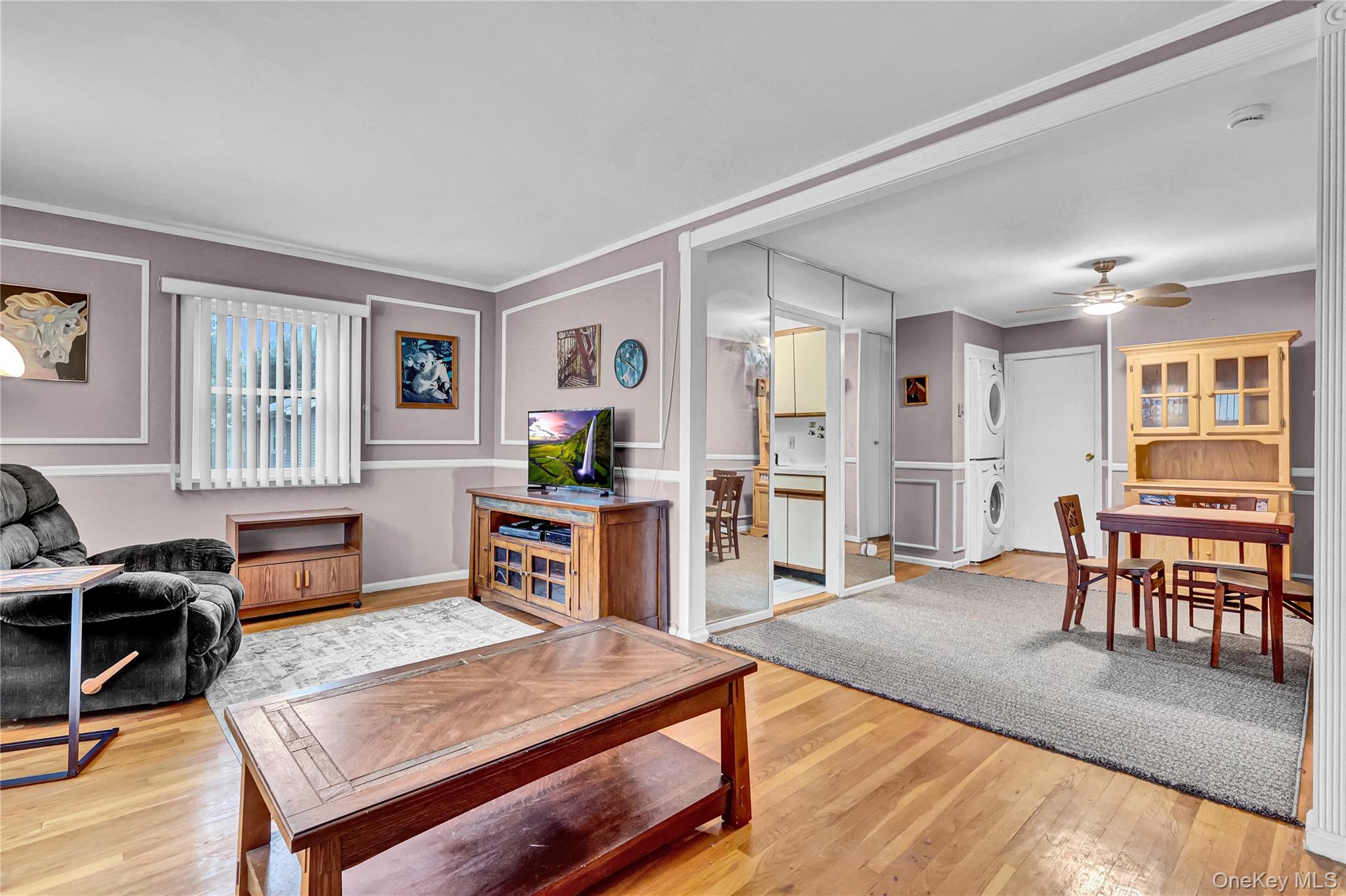 20 Toehee Place, Unit 2B Islip, NY 11751 - Photo 6 of 25 a living room with furniture and a wooden floor