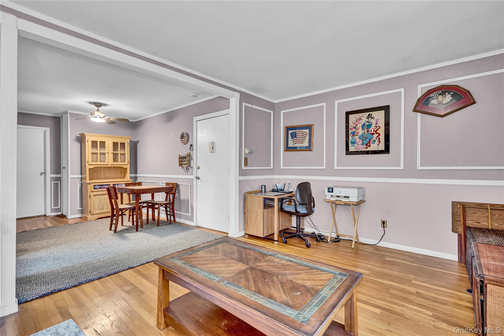 20 Toehee Place, Unit 2B Islip, NY 11751 - Photo 7 of 25 a room with furniture and a table