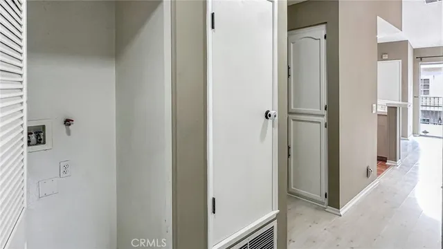 a view of a hallway with two rooms