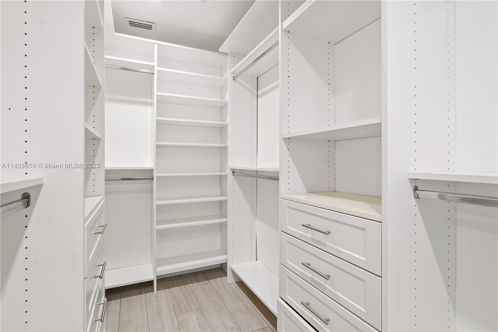 401 Southwest 23rd Road Miami, FL 33129 - Photo 12 of 43 a view of walk in closet with empty racks