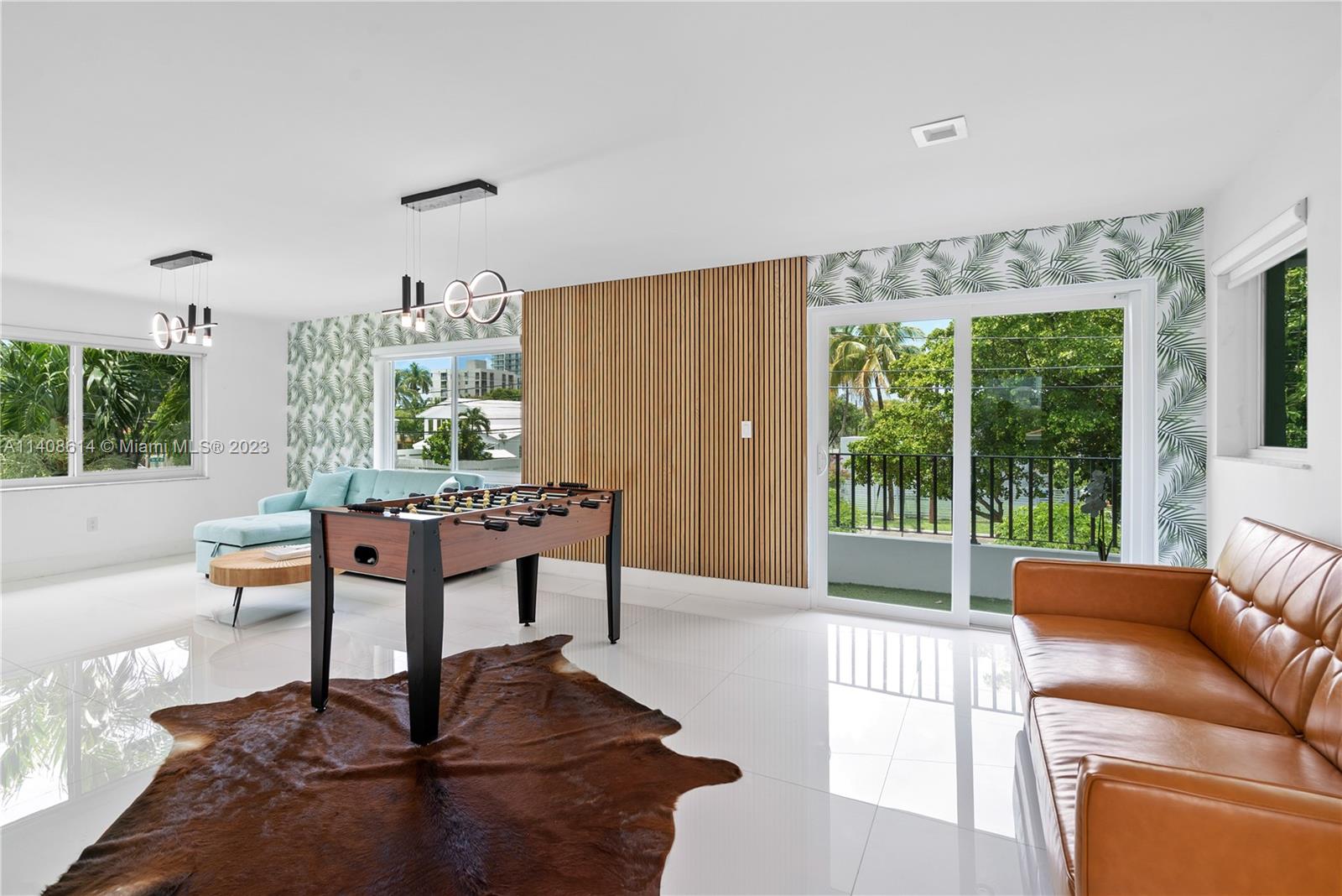 401 Southwest 23rd Road Miami, FL 33129 - Photo 16 of 43 a living room with furniture and a potted plant
