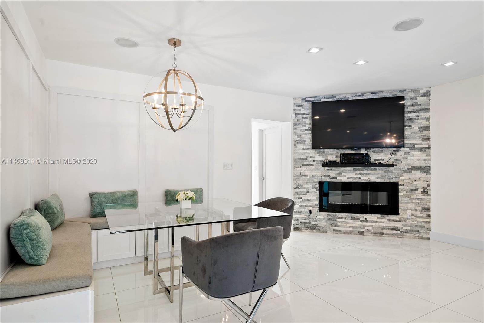 401 Southwest 23rd Road Miami, FL 33129 - Photo 21 of 43 a living room with fireplace furniture and a flat screen tv