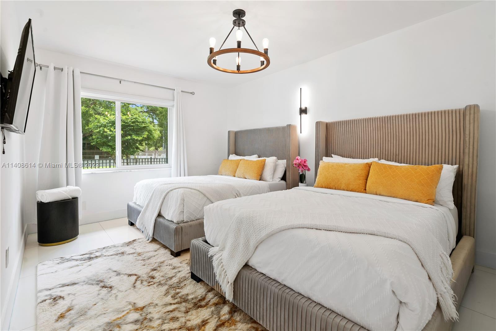 401 Southwest 23rd Road Miami, FL 33129 - Photo 25 of 43 a bedroom with a bed and wooden floor