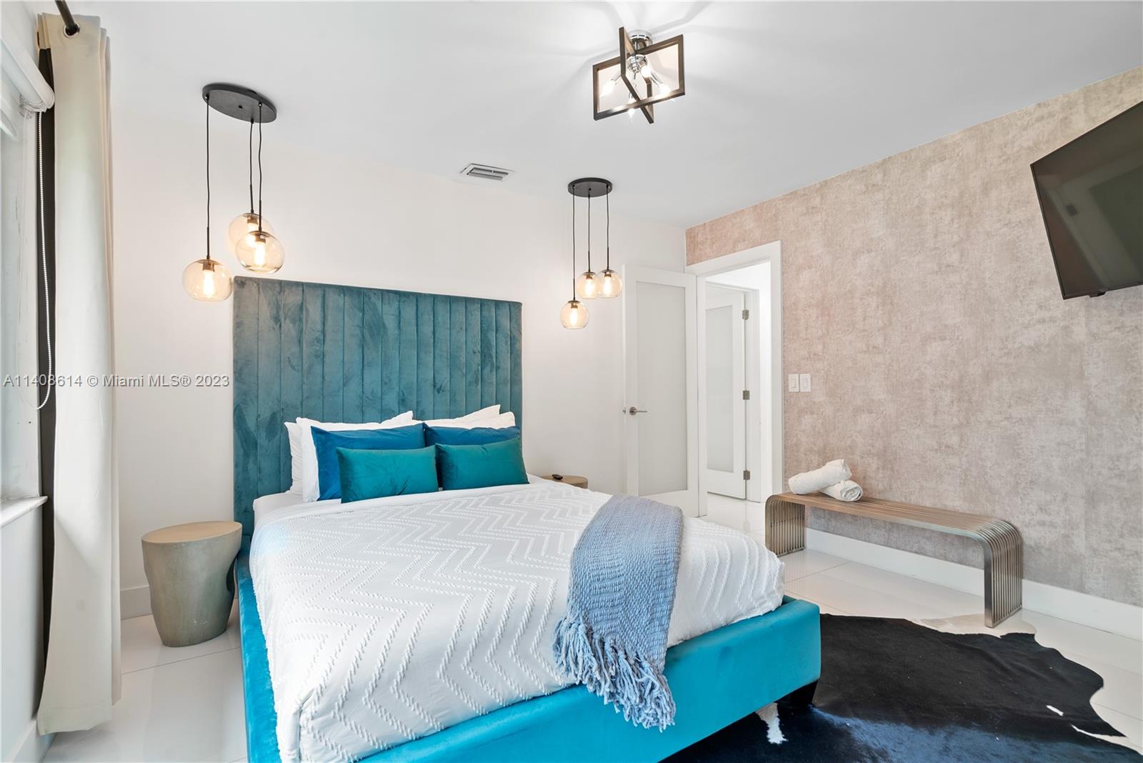 401 Southwest 23rd Road Miami, FL 33129 - Photo 28 of 43 a bedroom with a bed and a television