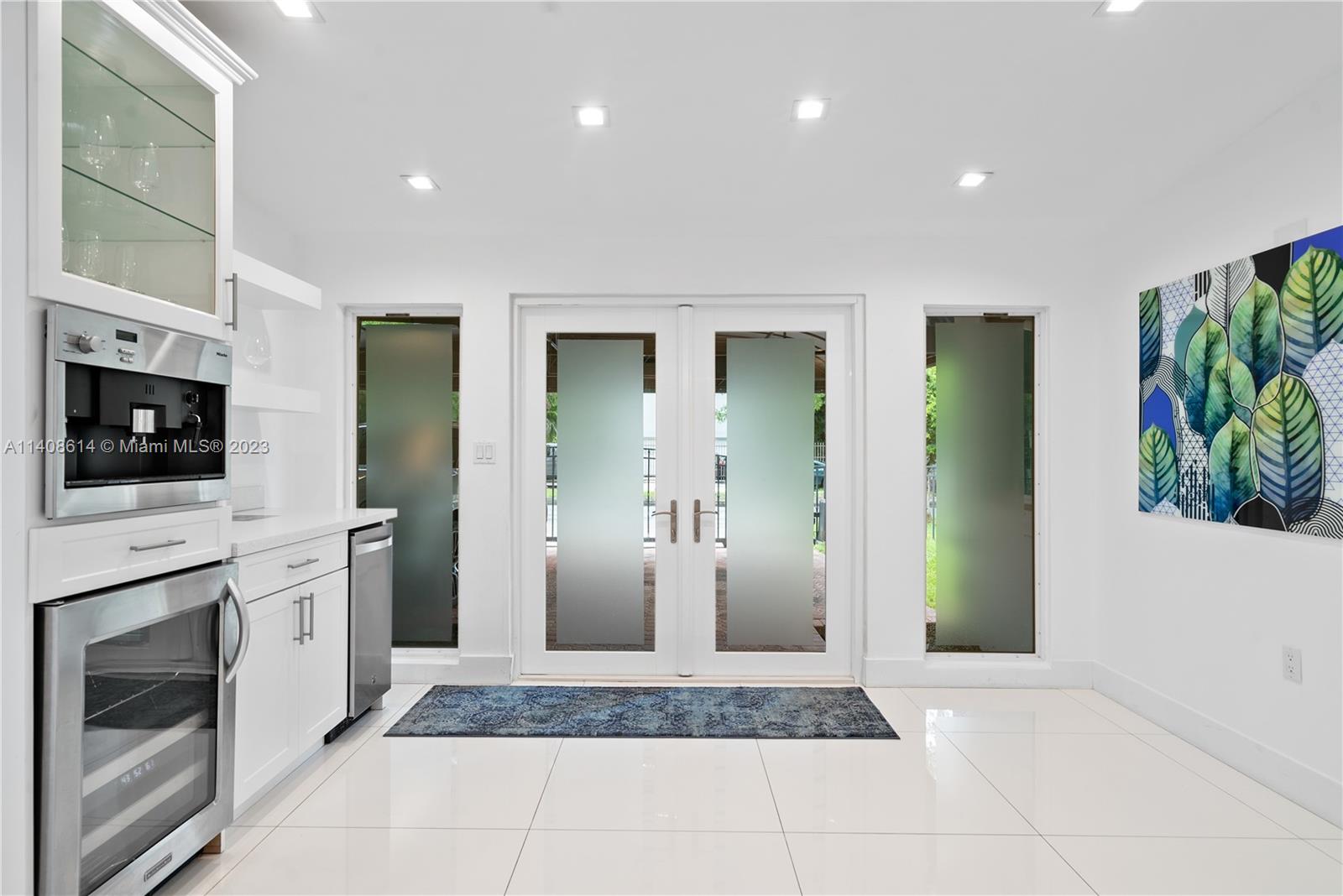 401 Southwest 23rd Road Miami, FL 33129 - Photo 33 of 43 a view of a kitchen with a sink and a fireplace