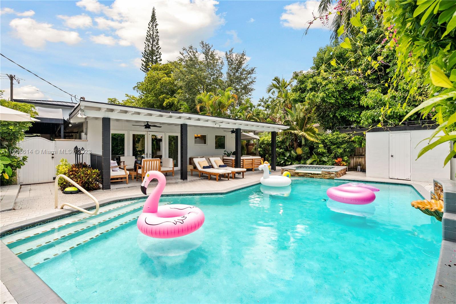 401 Southwest 23rd Road Miami, FL 33129 - Photo 39 of 43 a front view of a house with swimming pool garden and patio