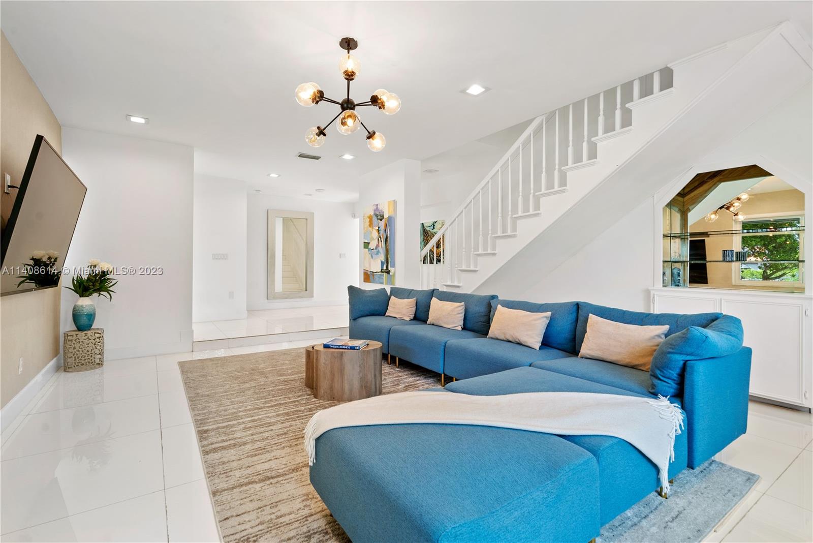 401 Southwest 23rd Road Miami, FL 33129 - Photo 4 of 43 a living room with furniture and a flat screen tv