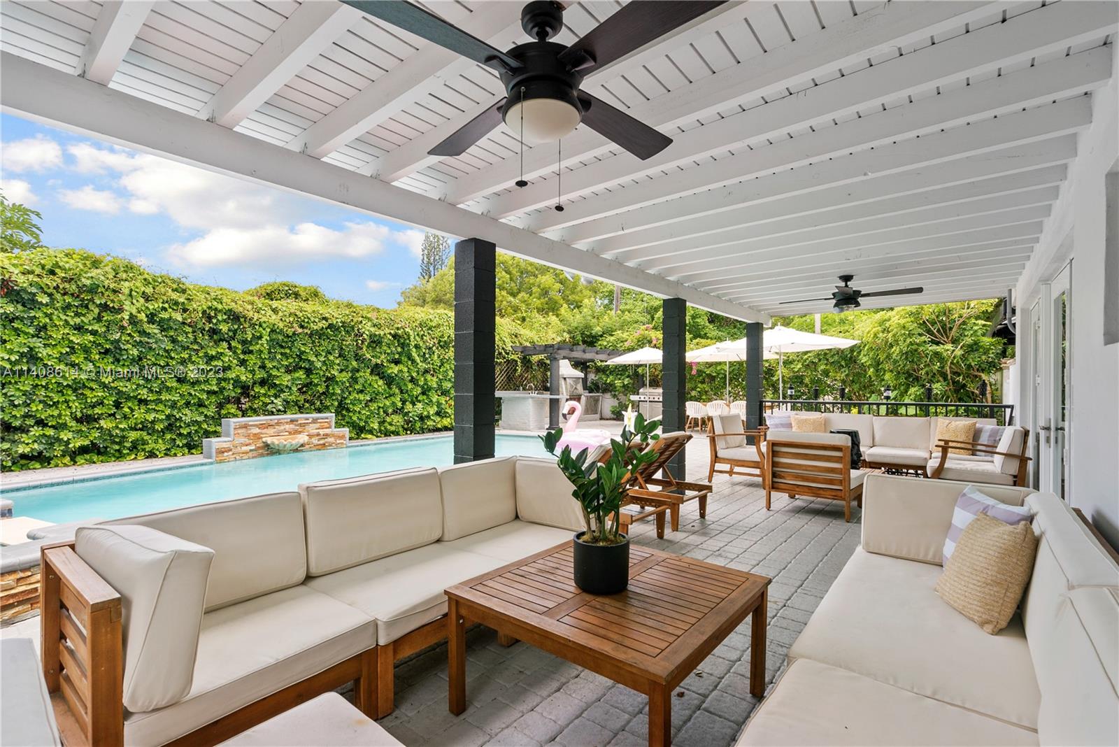 401 Southwest 23rd Road Miami, FL 33129 - Photo 10 of 43 a living room with patio furniture and a potted plants