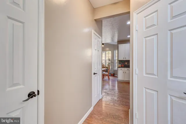 a kitchen with stainless steel appliances granite countertop a refrigerator a stove a sink and a microwave