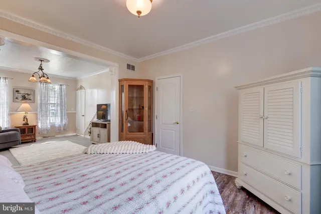 a view of a hallway with a window and stairs
