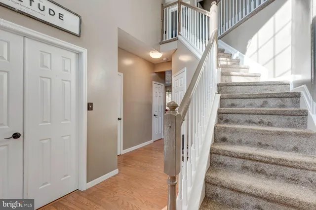 a spacious bedroom with a large bed and a large window