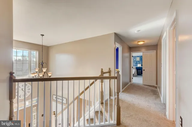 a bedroom with furniture a flat screen tv and a fireplace