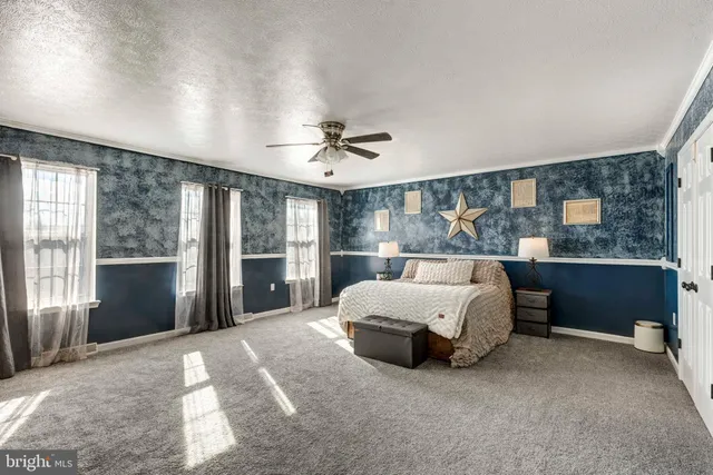 a spacious bathroom with a sink mirror and a bath tub