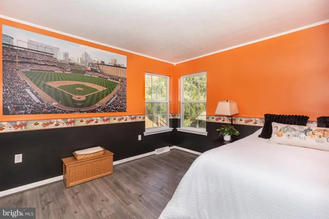 a bedroom with a bed and a book shelf