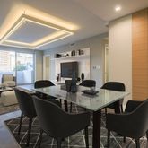 a view of a dining room with furniture and wooden floor