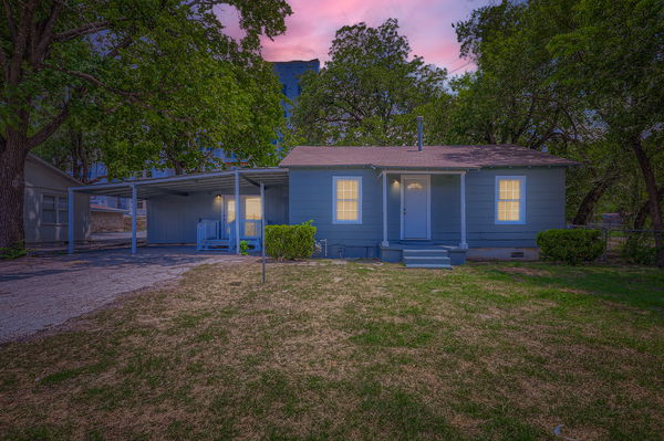 700 West St Johns Avenue Austin, TX 78752 - Photo 16 of 16 a view of a yard in front of a house with large tree