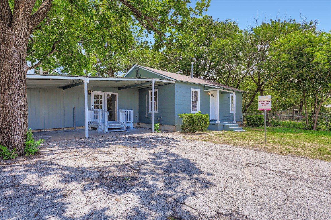 700 West St Johns Avenue Austin, TX 78752 - Photo 2 of 16 a view of a house with backyard and a tree