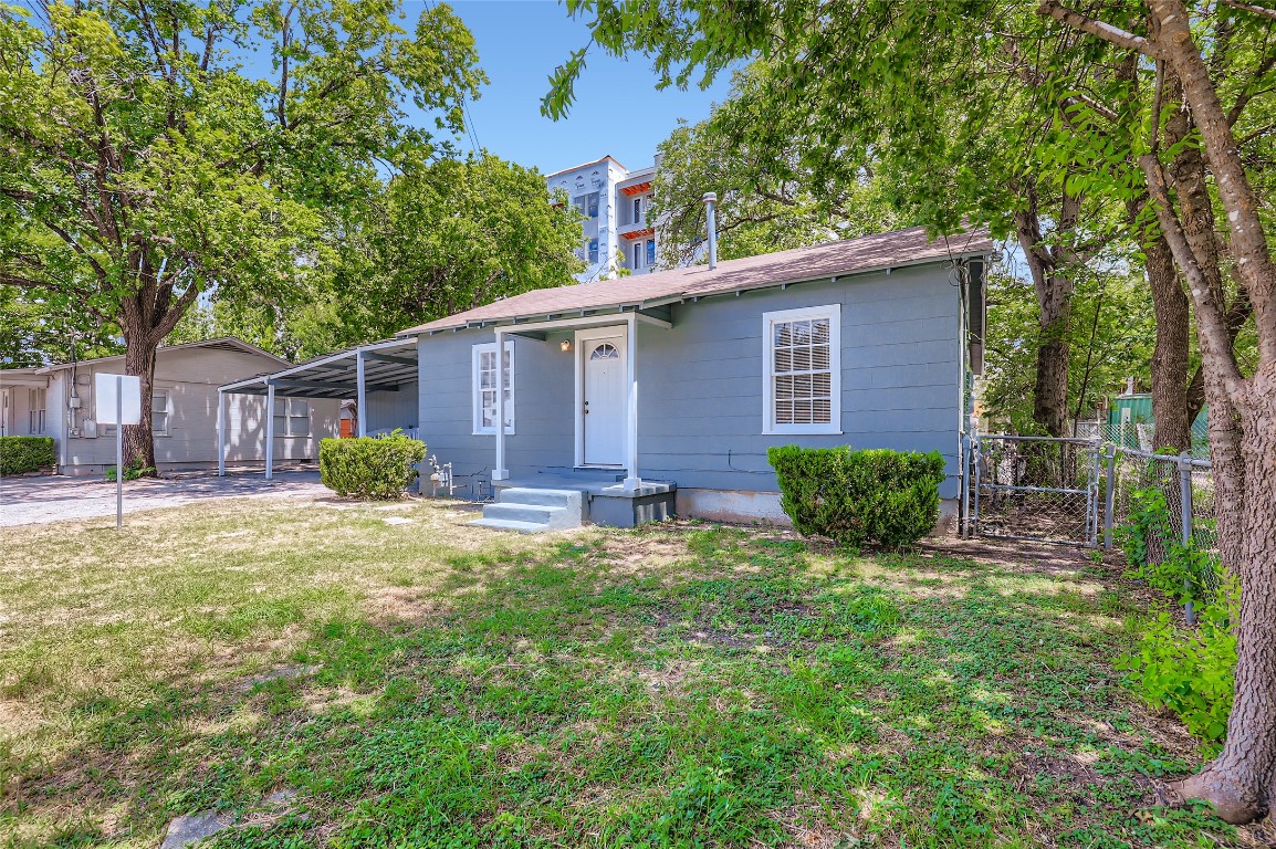 700 West St Johns Avenue Austin, TX 78752 - Photo 3 of 16 a view of backyard of house with green space