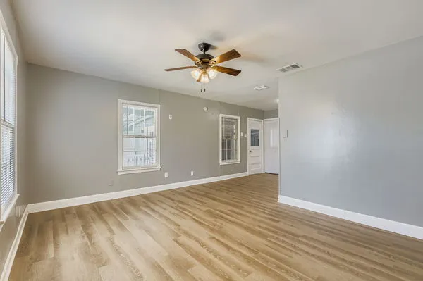 a view of an empty room with a window
