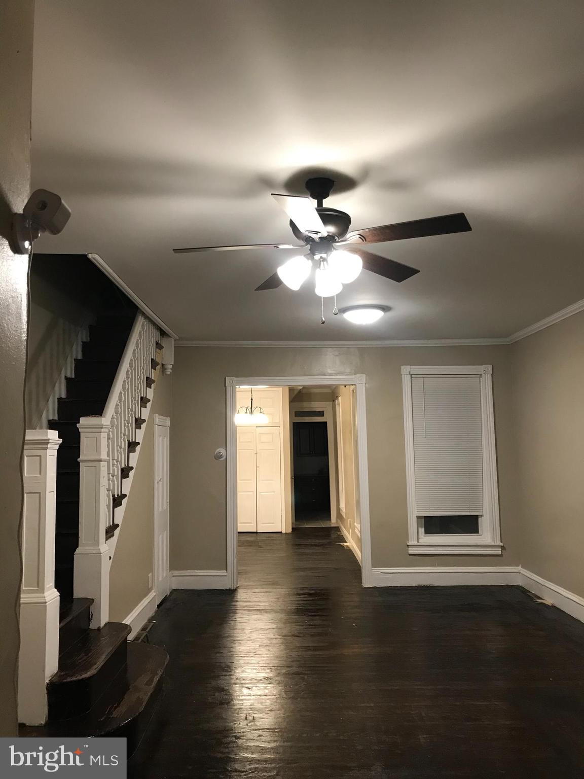 1626 Mineral Spring Road Reading, PA 19602 - Photo 2 of 20 a view of an empty room with wooden floor and a ceiling fan