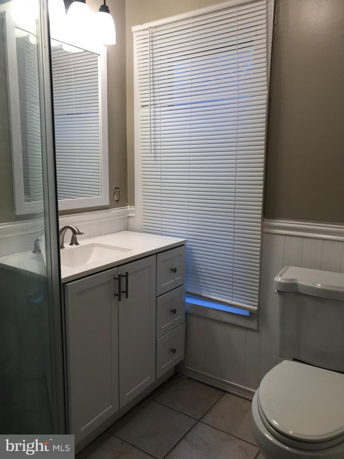1626 Mineral Spring Road Reading, PA 19602 - Photo 14 of 20 a bathroom with a sink a toilet and shower