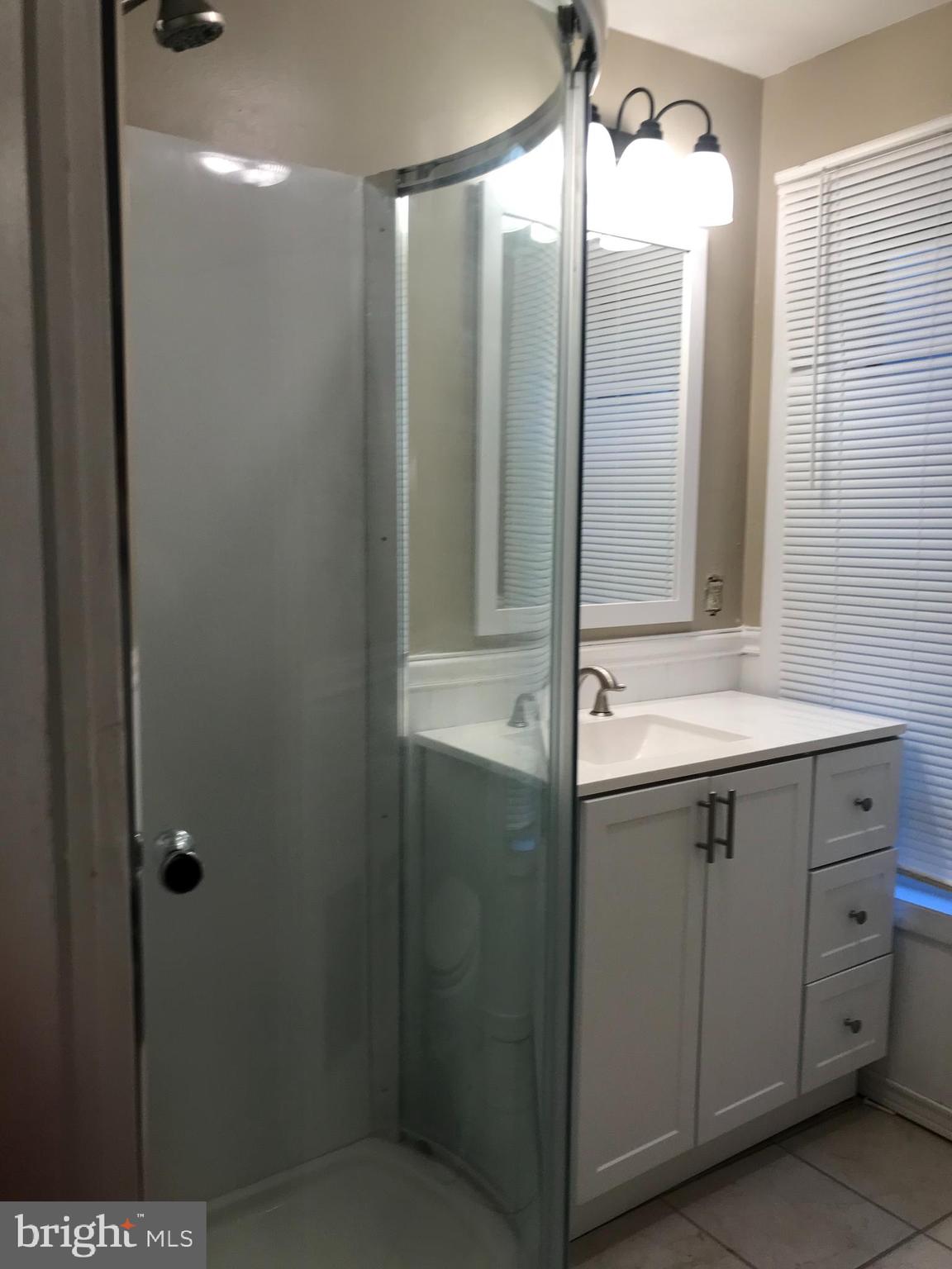 1626 Mineral Spring Road Reading, PA 19602 - Photo 15 of 20 a bathroom with a sink and mirror