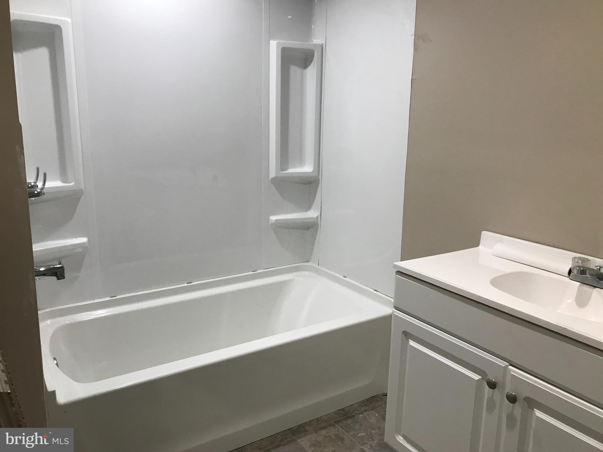 1626 Mineral Spring Road Reading, PA 19602 - Photo 17 of 20 a bathroom with a bathtub and a sink