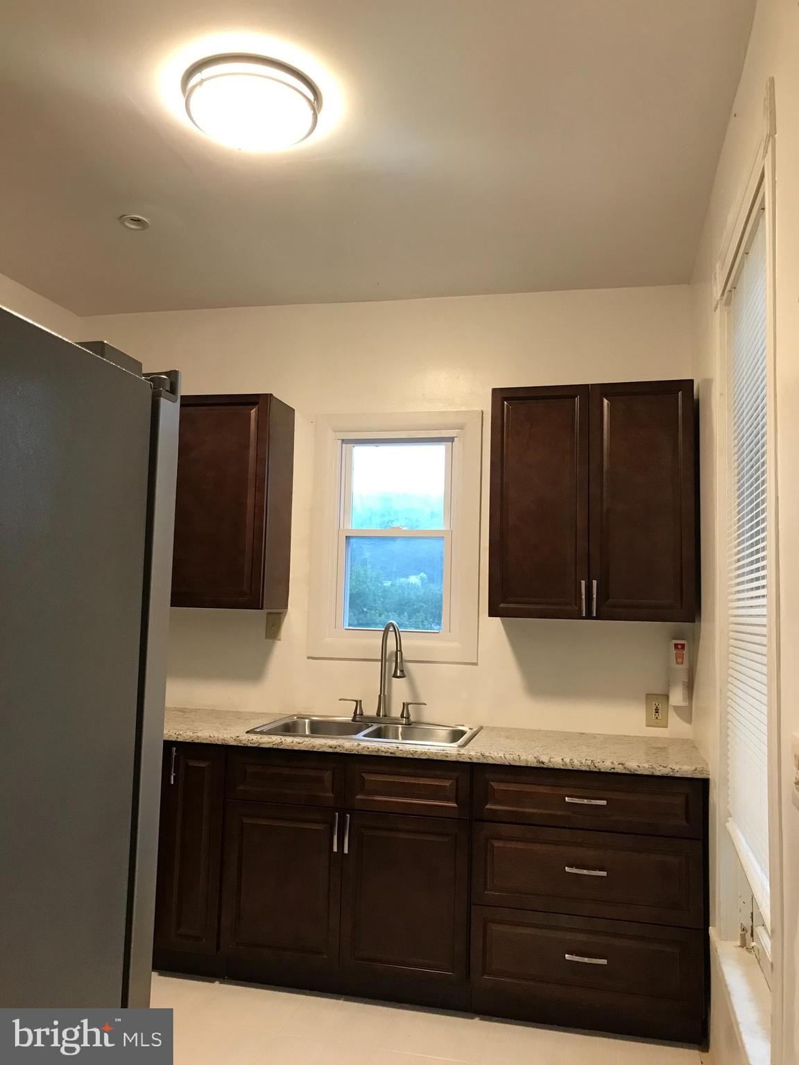 1626 Mineral Spring Road Reading, PA 19602 - Photo 5 of 20 a bathroom with a sink and a mirror