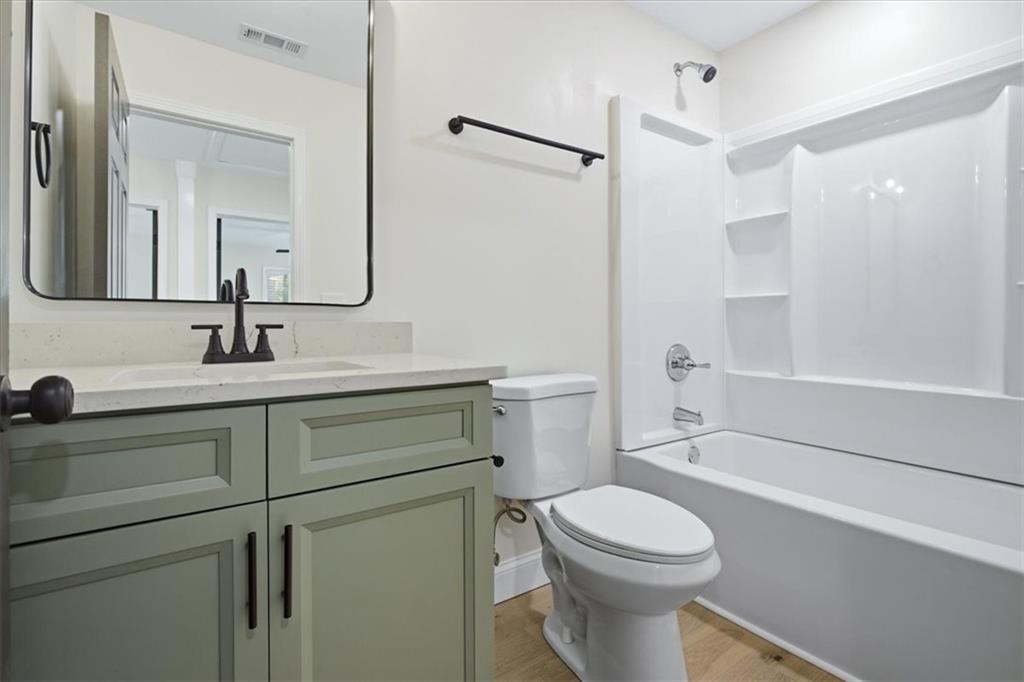 4911 Lower Jersey Road Oxford, GA 30054 - Photo 17 of 56 a bathroom with a sink a toilet and shower