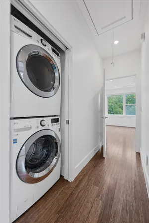 a view of a hallway with washer and dryer
