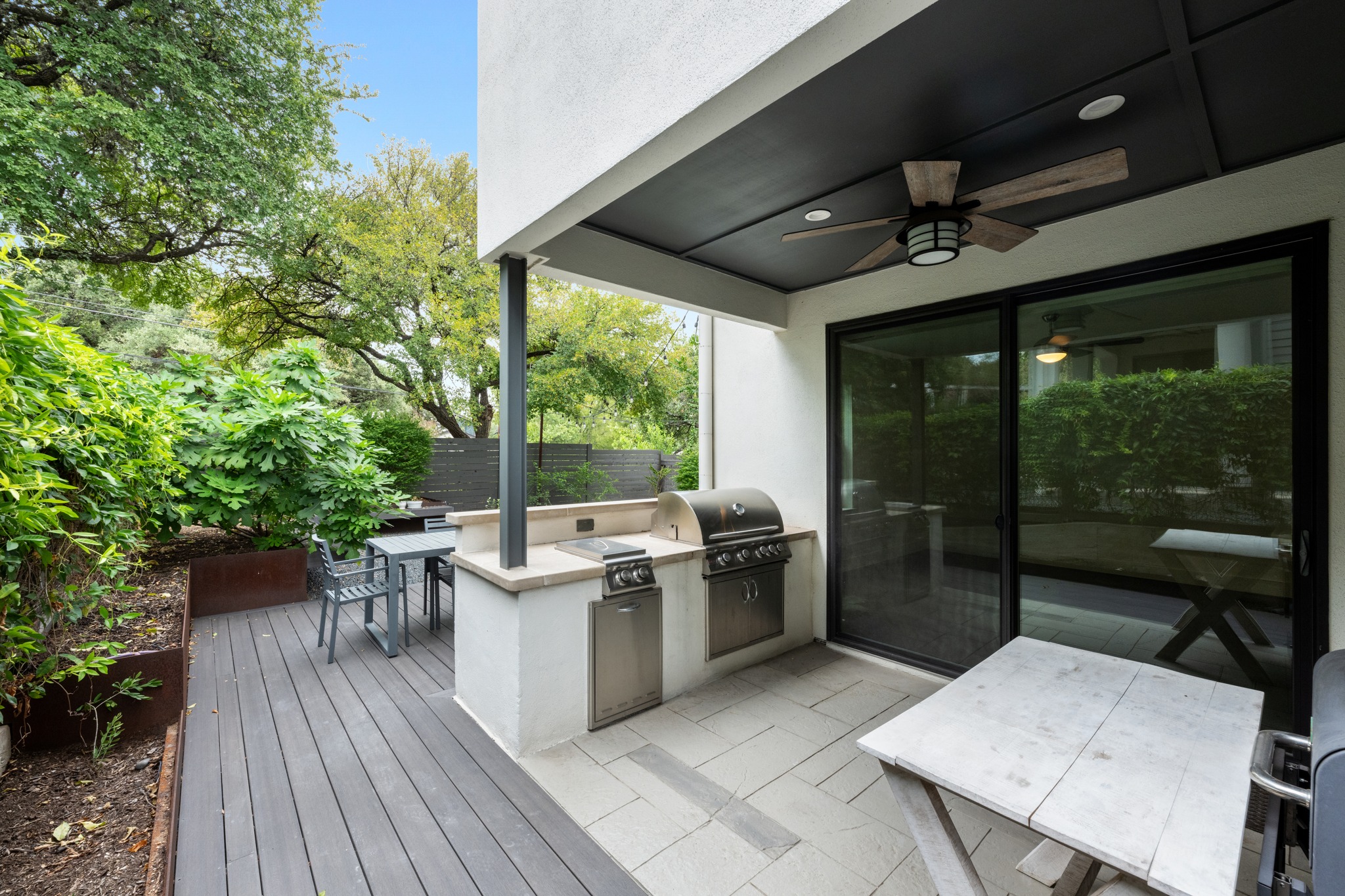 1303 Azie Morton Road, Unit 3 Austin, TX 78704 - Photo 16 of 24 a view of a patio with a table and chairs