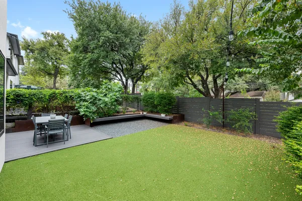 a view of a backyard with sitting area