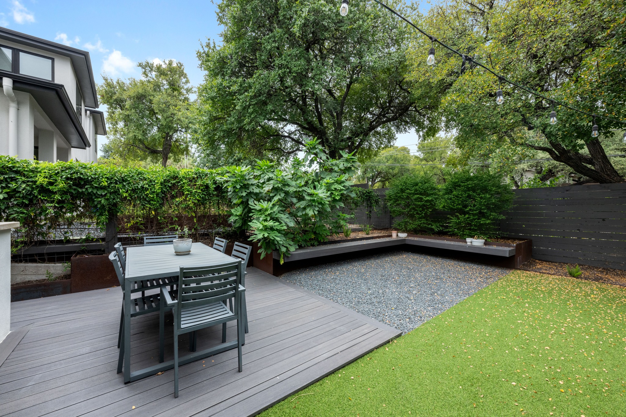 1303 Azie Morton Road, Unit 3 Austin, TX 78704 - Photo 20 of 24 a backyard of a house with wooden floor and outdoor seating