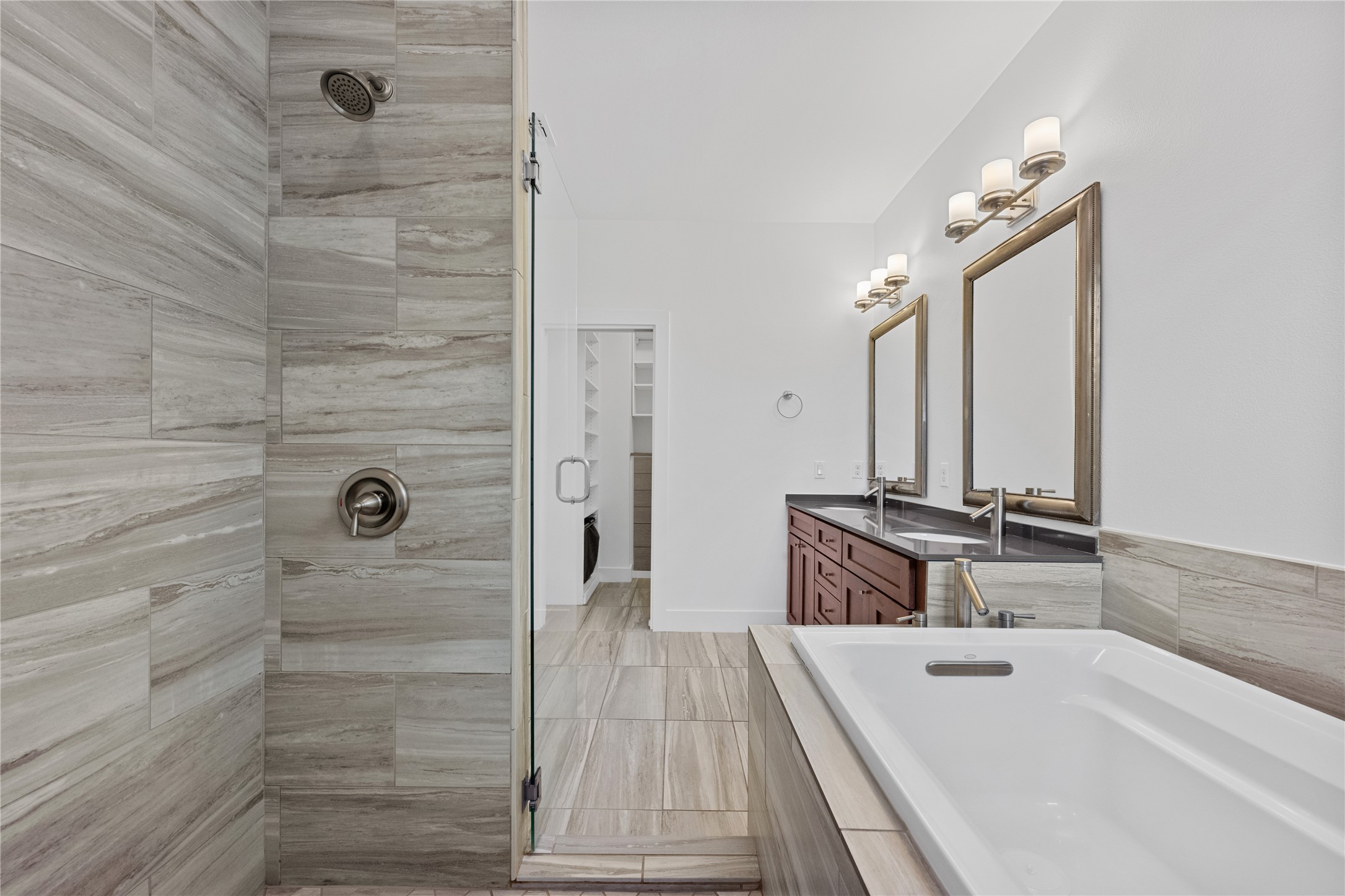 1303 Azie Morton Road, Unit 3 Austin, TX 78704 - Photo 10 of 24 a bathroom with a double vanity sink a mirror and shower