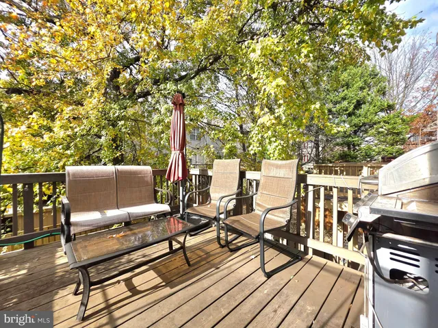 a roof deck view with a sitting space