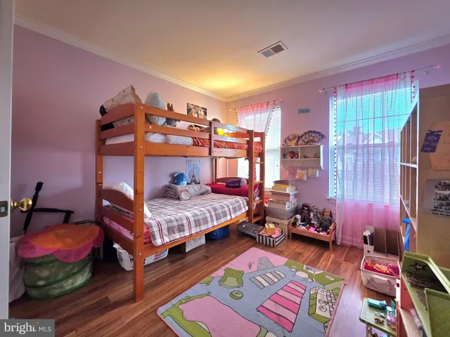 a bedroom with bed and a couch