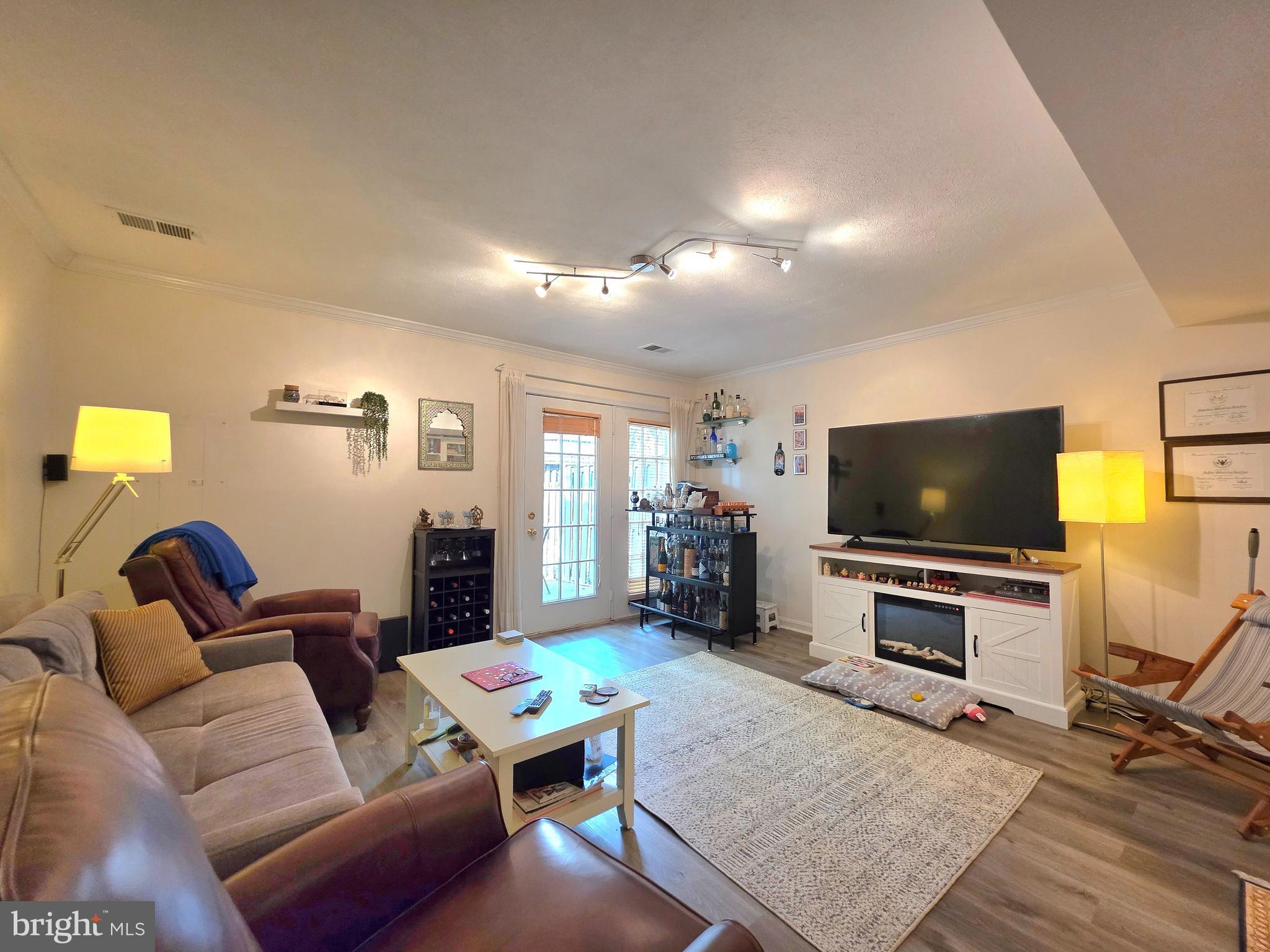 2826 Roesh Way Vienna, VA 22181 - Photo 28 of 36 a living room with furniture and a flat screen tv