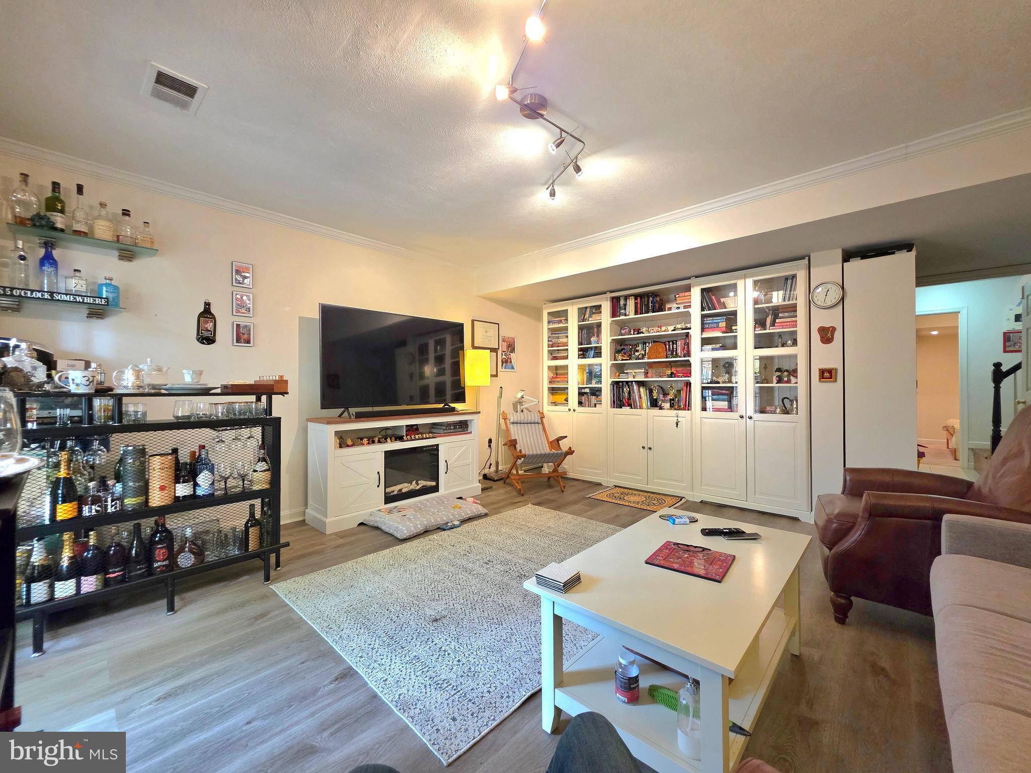 2826 Roesh Way Vienna, VA 22181 - Photo 29 of 36 a living room with furniture and a flat screen tv