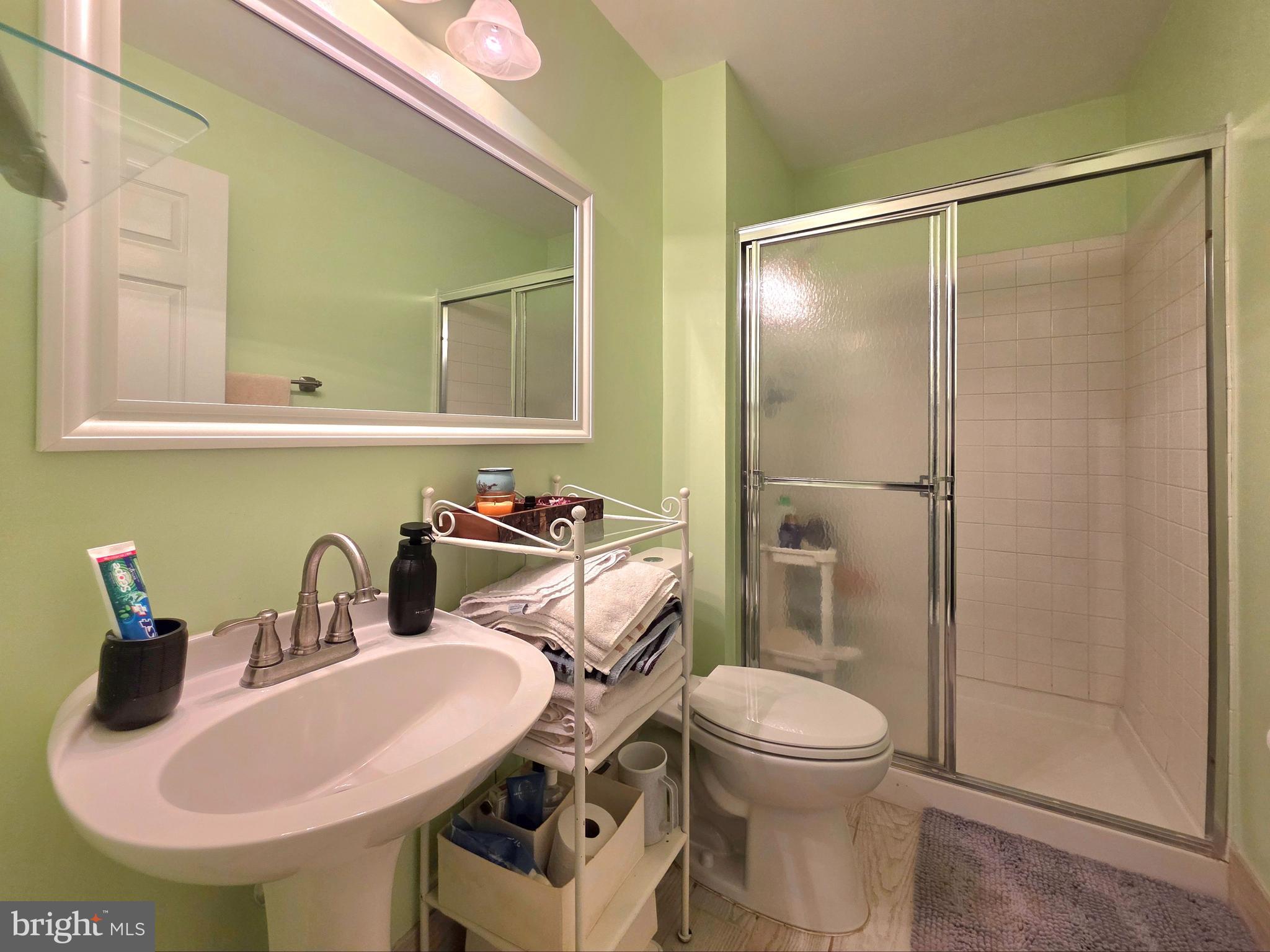 2826 Roesh Way Vienna, VA 22181 - Photo 30 of 36 a bathroom with a sink toilet and shower